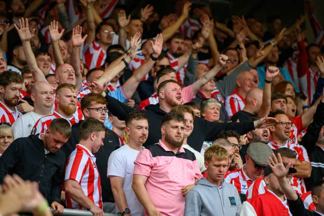 Sunderland fans in action at the Stadium of Light during the game against Fulham in the Premier League. Photo by Chris Fryatt.