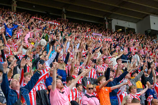 Sunderland fans in action at the Stadium of Light during the game against Fulham in the Premier League. Photo by Chris Fryatt.