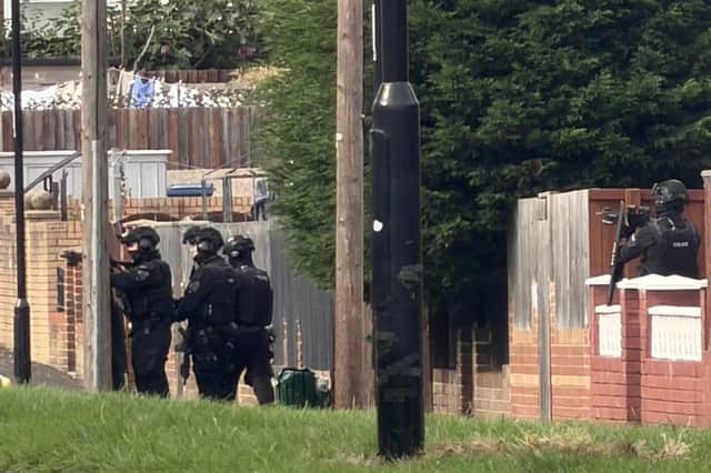 Armed police officers at the scene of the incident.