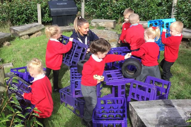Nursery manager Ashley Almond working with the children.