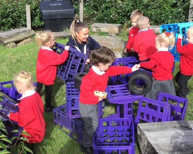 Nursery manager Ashley Almond working with the children.