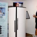 Co-owner Steve McMullen demonstrating the Whole Body Cryotherapy.