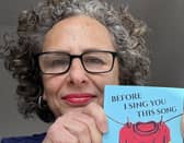 Justine Sless with her new book Before I Sing You This Song.
