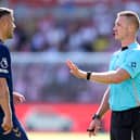 Referee Thomas Bramall with Granit Xhaka of Sunderland during the Black Cats draw at Brentford.