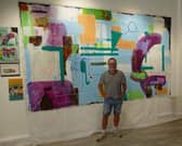 Barrie Watson standing beside the completed 3.5m × 2.5m commission at 24NE Contemporary Art Gallery, Sunderland.