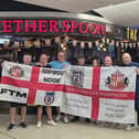 Peter Oliver, in the blue shirt at the centre, joins other fans who set off from Gatwick for Portugal today.
