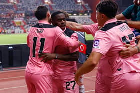 Sunderland players celebrate after late Europa League drama.