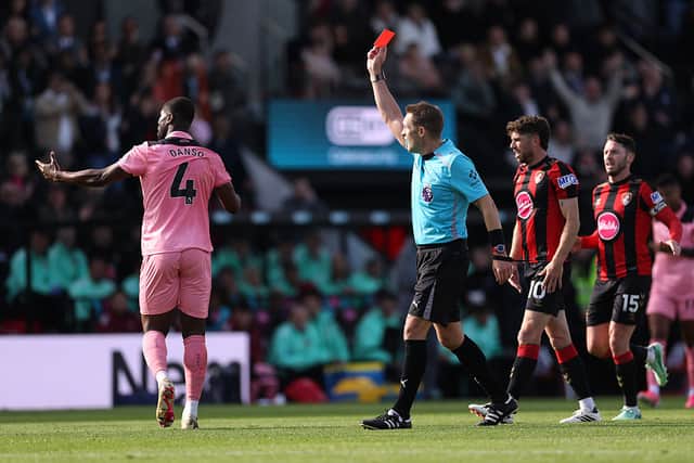 Kevin Danso is shown a red card at the Vitality Stadium.