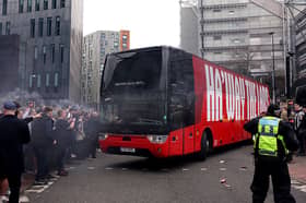 The Sunderland team bus drives through a crowd of Newcastle United fans prior to the Premier League match between Newcastle United and Sunderland at St James' Park on March 22, 2026.