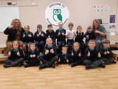 Headteacher Audrey Bolam and deputy headteacher Angela Butler celebrate their Ofsted report with the school's children.