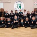 Headteacher Audrey Bolam and deputy headteacher Angela Butler celebrate their Ofsted report with the school's children.