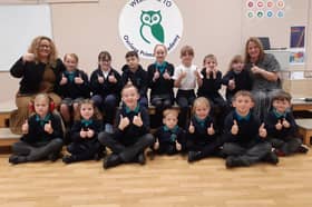 Headteacher Audrey Bolam and deputy headteacher Angela Butler celebrate their Ofsted report with the school's children.