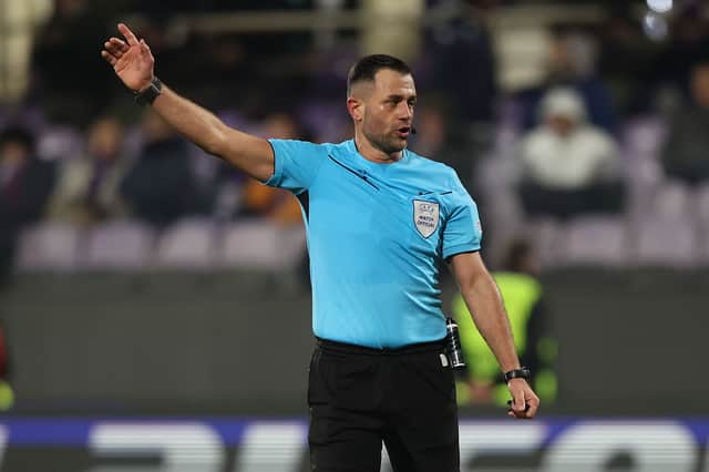 Referee Balazs Berke gestures during the UEFA Europa League between Fiorentina LASK in December 2024.
