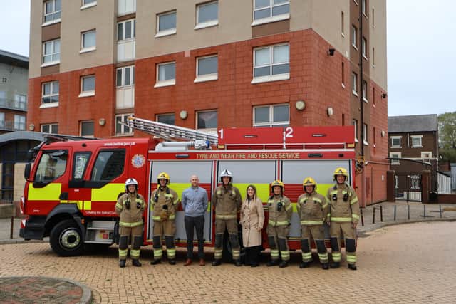 Leon Stephenson and Stacey Thwaites from Gentoo pictured with firefighters from the Tyne and Wear Fire and Rescue Service.