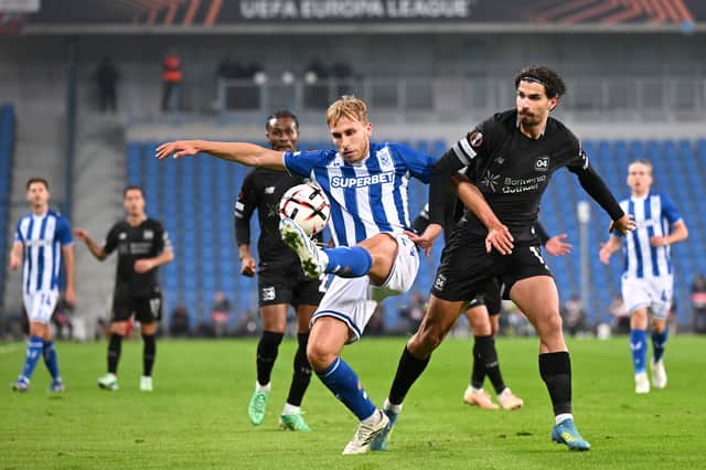Michal Gurgul of Lech Poznan in action against Bayer Leverkusen.