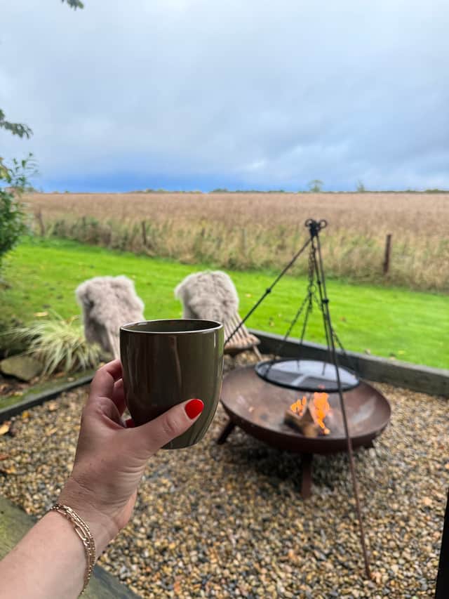 View from the fire pit over the wild grass field