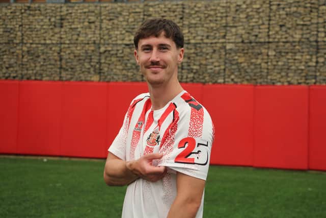 Trai Hume wearing the Foundation of Light's 25th anniversary shirt.