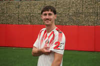 Trai Hume wearing the Foundation of Light's 25th anniversary shirt.
