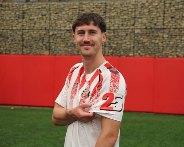 Trai Hume wearing the Foundation of Light's 25th anniversary shirt.