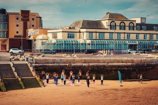 Beach Yoga held at the Wellness Collective’s sellout event in the Summer