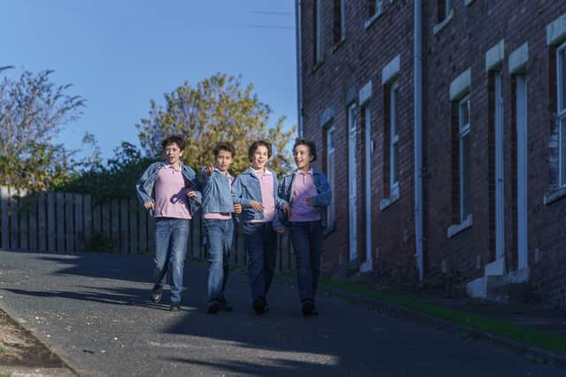 William Gurney, Rafferty Smale, Spencer Collins and Noah Mannion walking down Angus Street from the film.