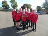Pupils from St John Bosco proudly display their Live Simply Award.
