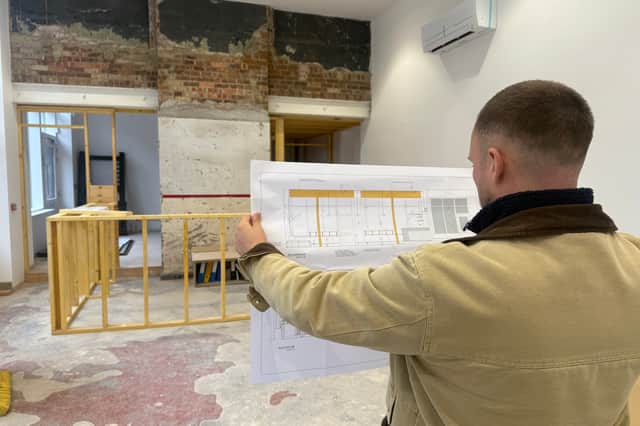 James checking out the plans as work forges ahead on Space coffee shop