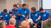 Grundfos workers take part in the football pumping challenge