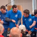 Grundfos workers take part in the football pumping challenge