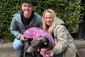 Kiki with her new owners in retirement, Natalie and Tom.