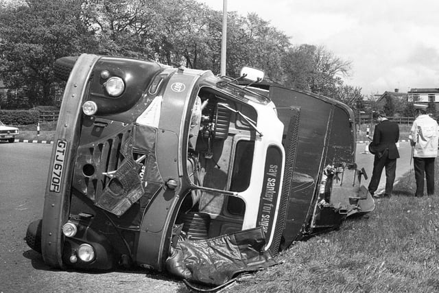 A Sankey Sugar tanker lorry is overturned at a Wigan roundabout in 1976