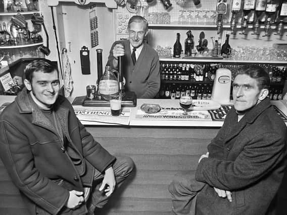 John Curtis, centre, landlord of Tontine's Delph Tavern, with customers, Tony Wilkinson and Thomas Glover, in March 1972.