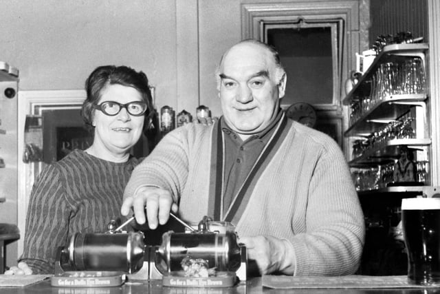 Former Wigan Rugby League great, Ken Gee, pulls his last pint with wife, Margaret, as he retires as landlord of the Railway Hotel in Pemberton on Tuesday 15th of January 1974.