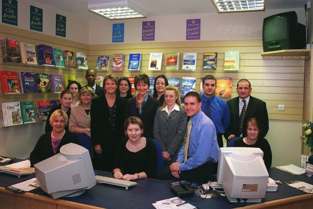 Stuart Priestley (front) with his team in the Leeds United Travel Shop.