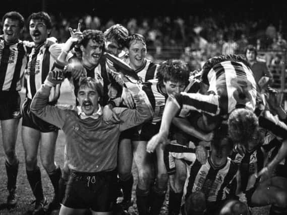 Chorley celebrate after their 3-0 victory over Wolves in the FA Cup first round second replay at Burnden Park