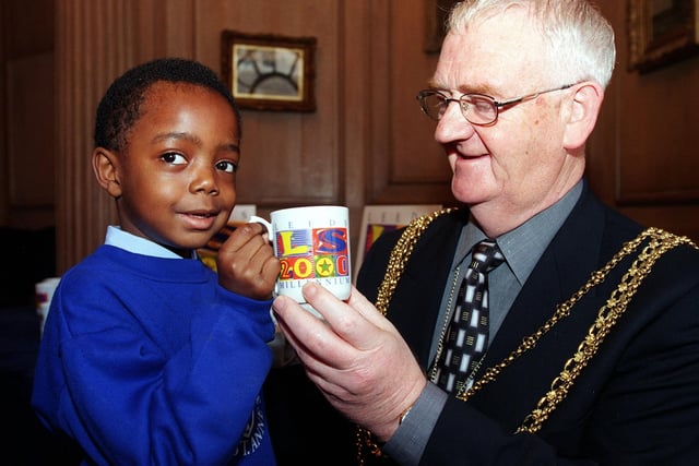 Young Jordayne Johnson was the  first school child in Leeds to receive a commemorative Millenium mug. He is pictured withthe Lord Mayor of Leeds, Councillor Keith Parker.