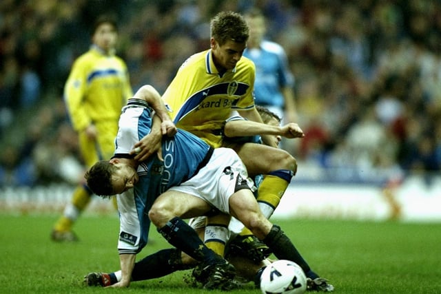Manchester City's Paul Dickov tussles with Jonny Woodgate during the FA Cup fourth round clash at Maine Road in January 2000.