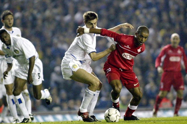 Jonny Woodgate gets to grips with Carlos Silva Welton of Hapoel Tel-Aviv during the UEFA Cup second round first leg clash at Elland Road in October 2002.