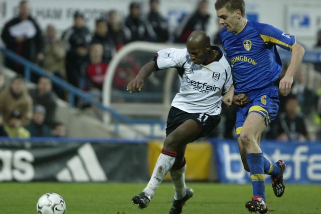 Jonny Woodgate tries to tackle Fulham's Luis Boa Morte during the FA Barclaycard Premiership clash at Craven Cottage in December 2002.
