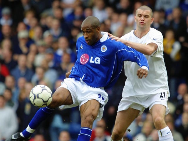 Leicester City striker Brian Deane holds the ball up against Dominic Matteo.