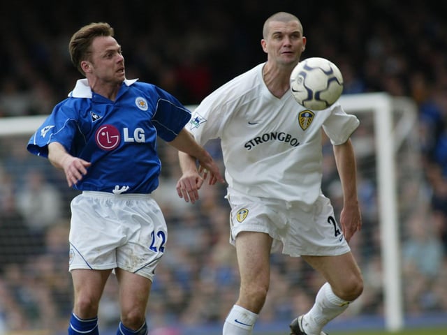 Leicester City striker Paul Dickov and Dominic Matteo battle for the ball.