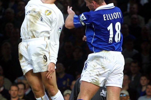 Mark Viduka and Leicester City's Matt Elliott rise high for a header.