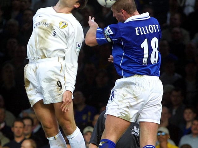 Mark Viduka and Leicester City's Matt Elliott rise high for a header.