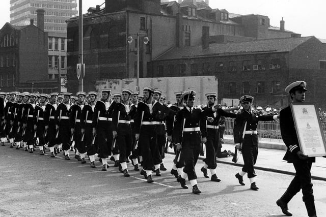 400 of the ships company took part in a march past from Leeds Civic Hall through the city centre, bearing the charter. Cookridge Street is in the background.
