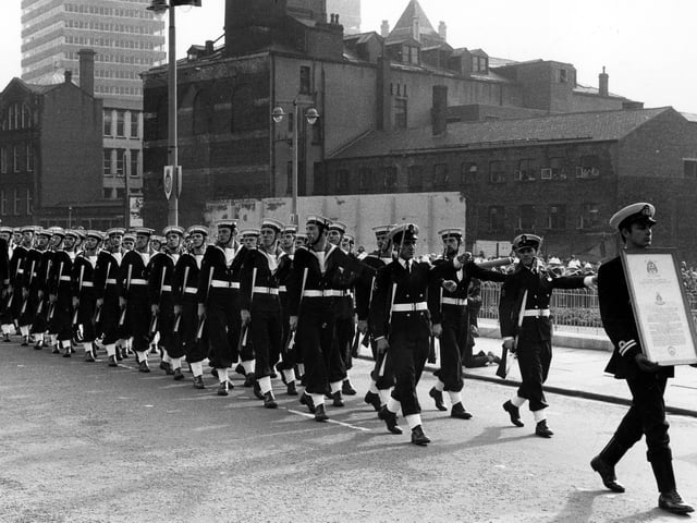 400 of the ships company took part in a march past from Leeds Civic Hall through the city centre, bearing the charter. Cookridge Street is in the background.