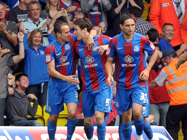 Paddy McCarthy celebrates with teammates after equalising for the Eagles.