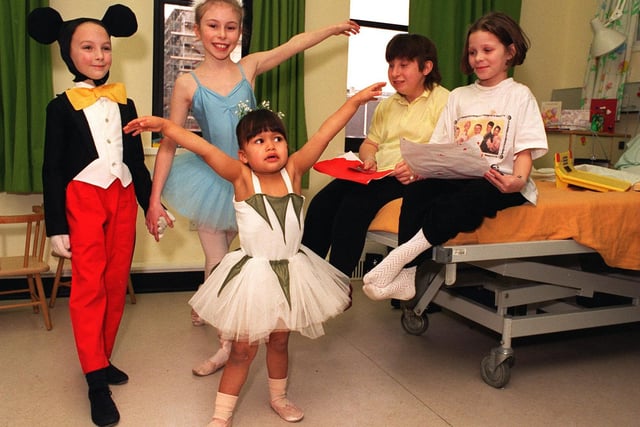 Children from a Leeds dancing academy raised hundreds of pounds for the city's childrens wards. Pictured are Paul Taylor, Alexandra Manning and Jasmine Naylor with patients Stacy Fisher and Clare Armitage (right).