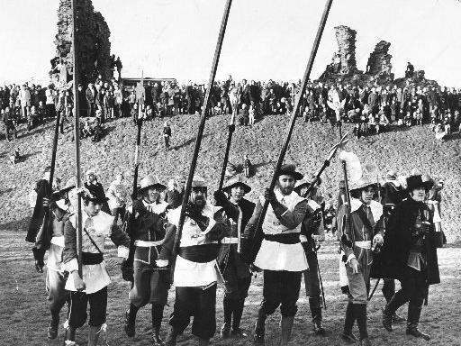 "Royalist" soldiers advance with pikes at the ready among the ruins of Sandal Castle in 1974 at the offical opening of the ruined Sandal Castle after ten years of excavations on the site by archeologists