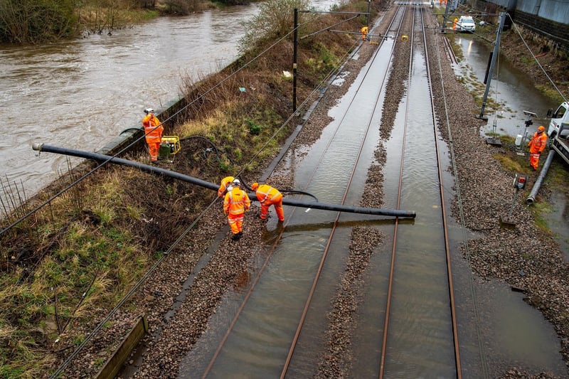 Network Rail working at Kirkstall Bridge where the railway line was flooded.