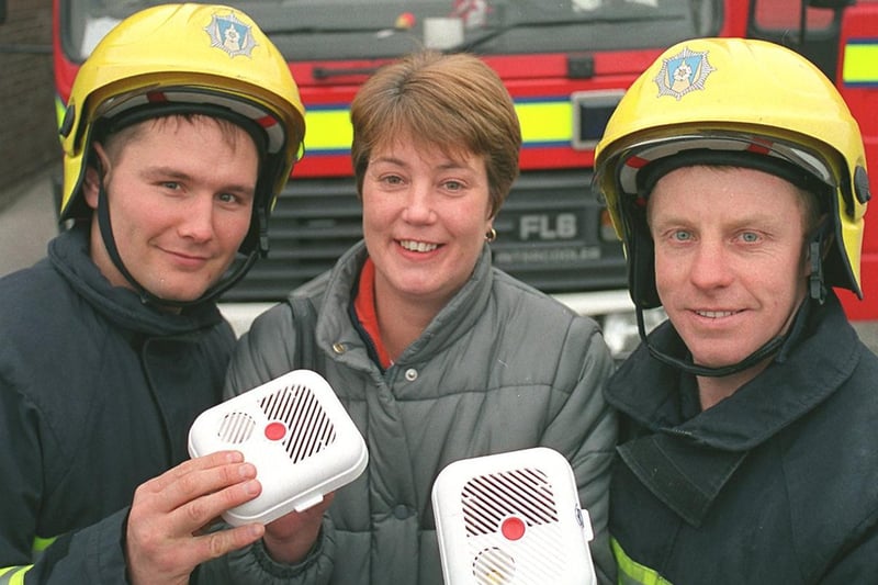 Deborah Hughes had her life saved by a smoke alarm after it alerted her of a fire in her Pudsey home. She returned to Pudsey Fire Station to thank firefighters Jon Dyminski (left) and Alan Greenwood.